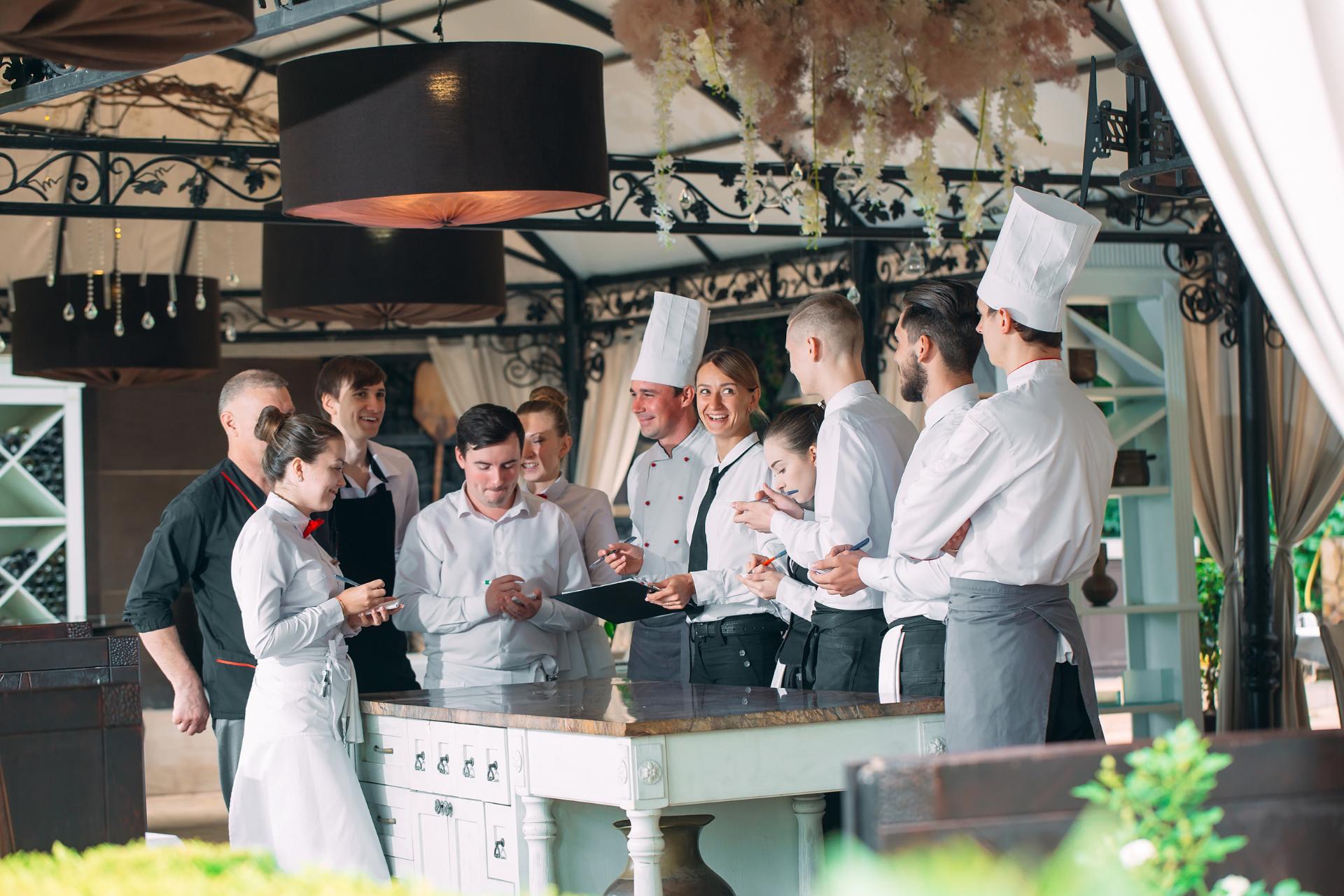 A restaurant with a lot of staff