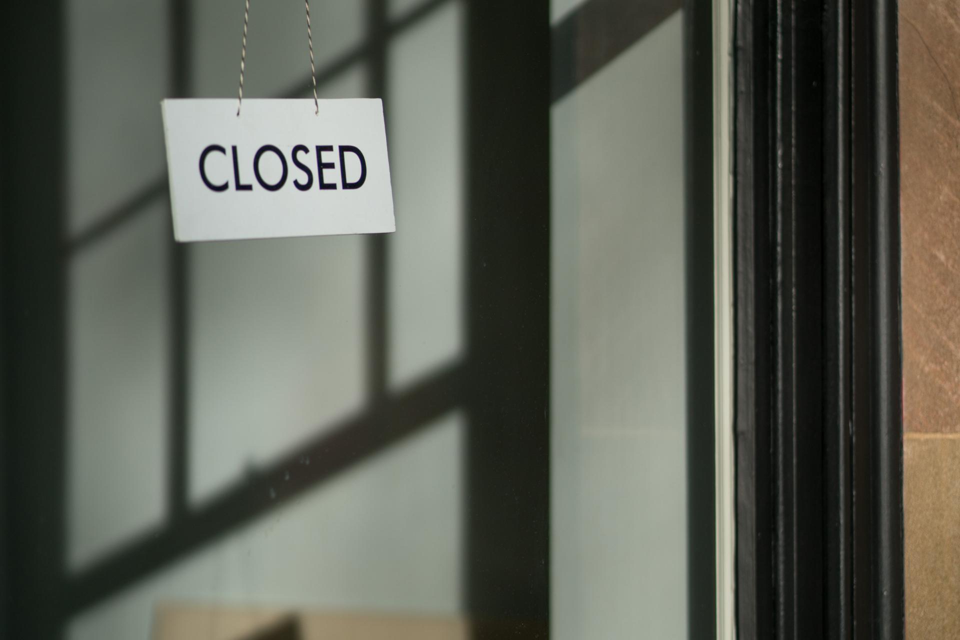 closed sign on glass door