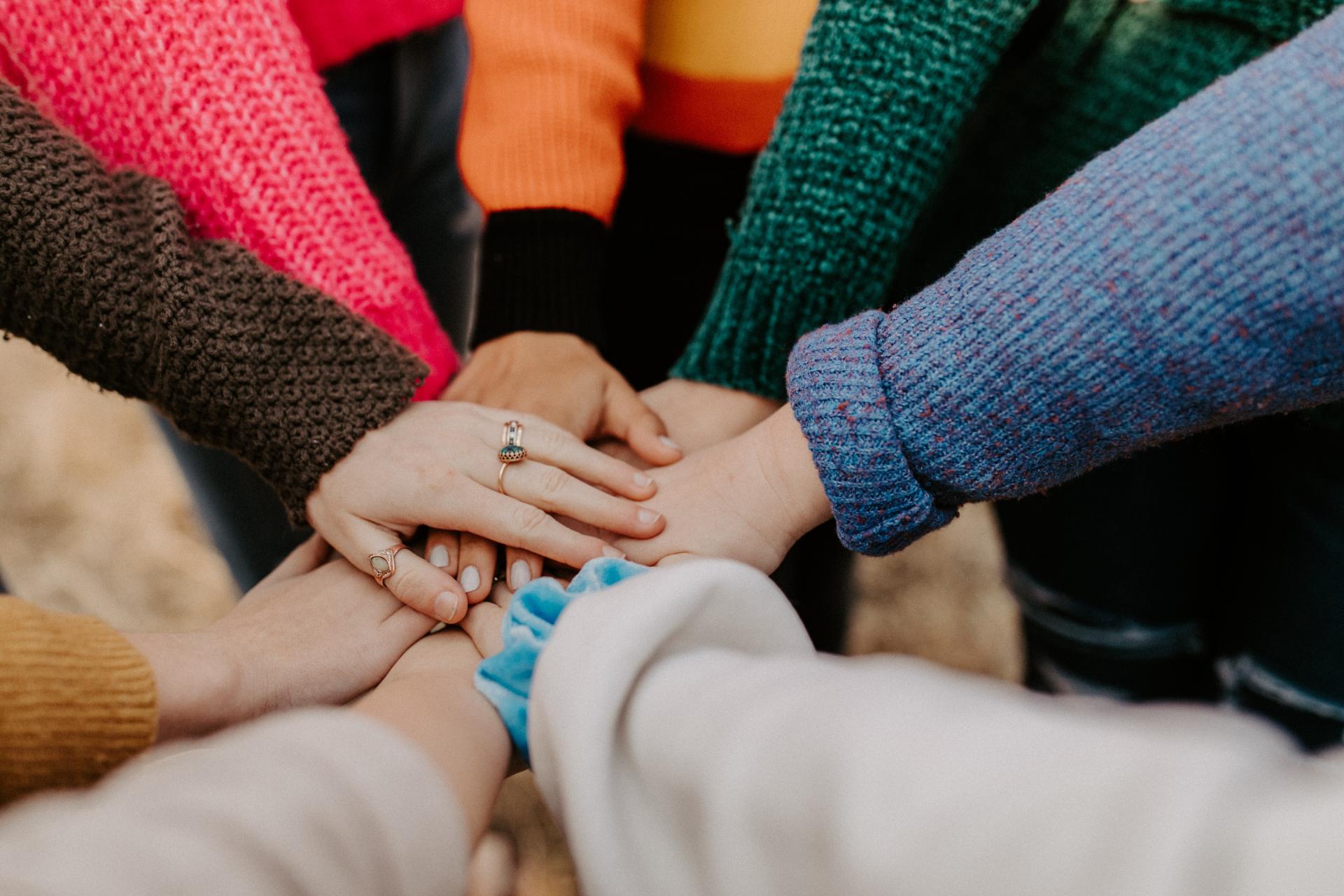 staff teamwork holding hands