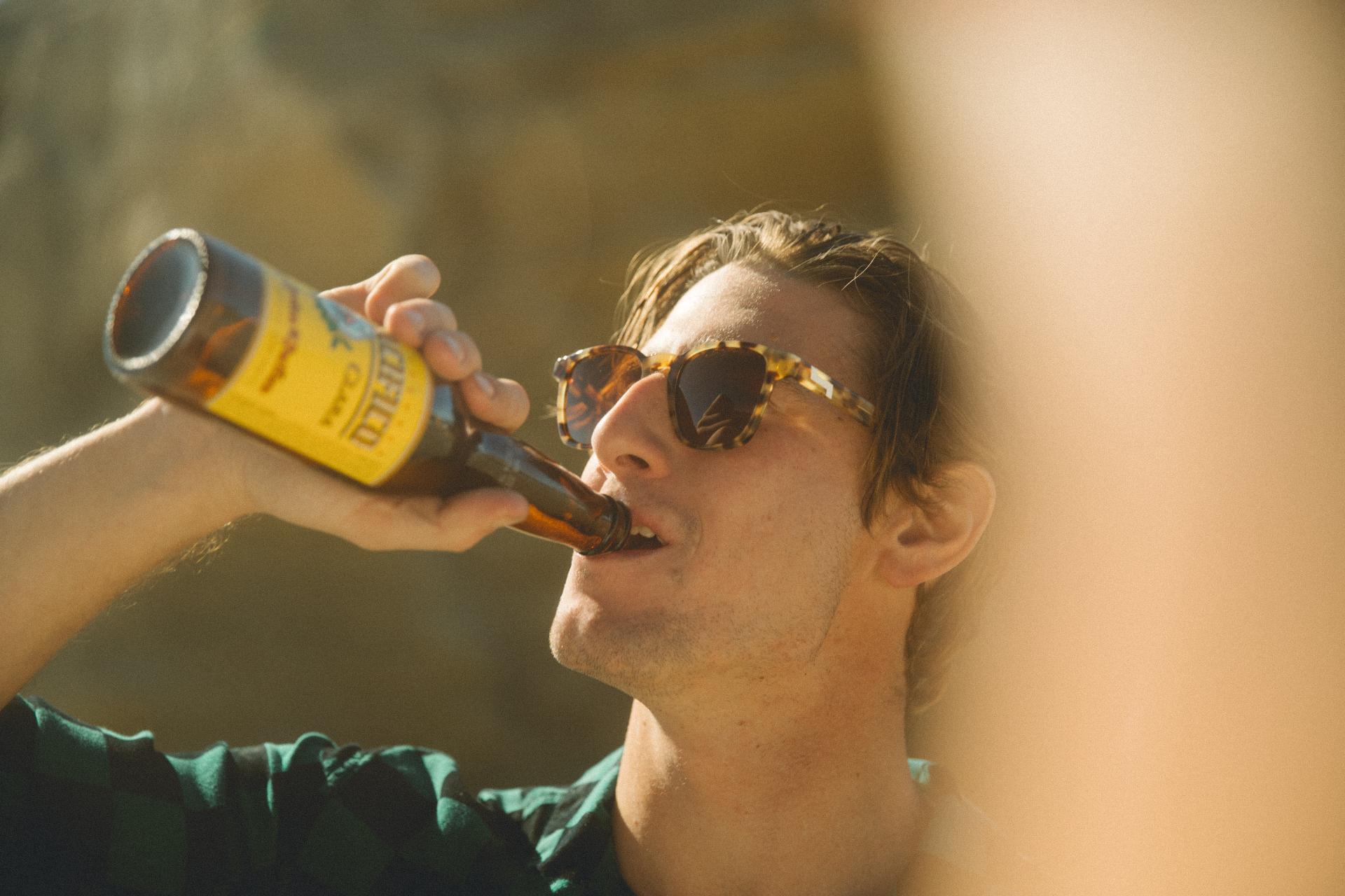 Guy drinking Mexican beer