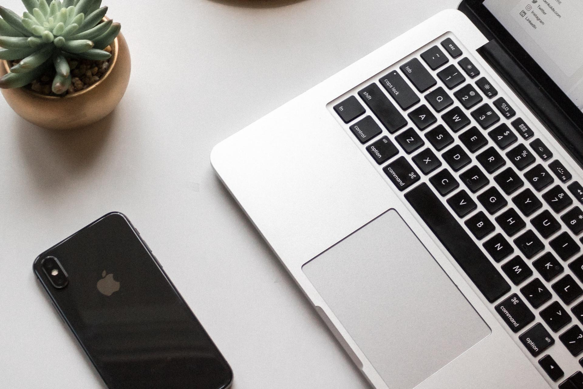 Laptop and iphone on a table