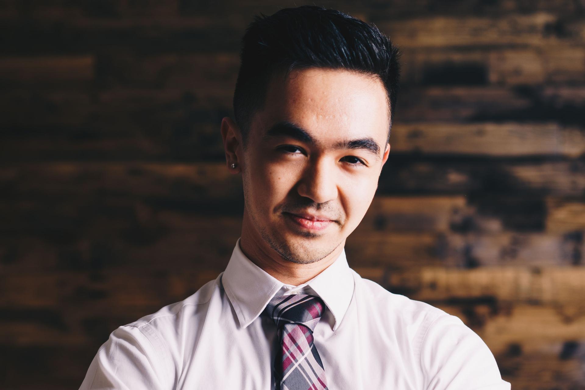Millenial employee smiling