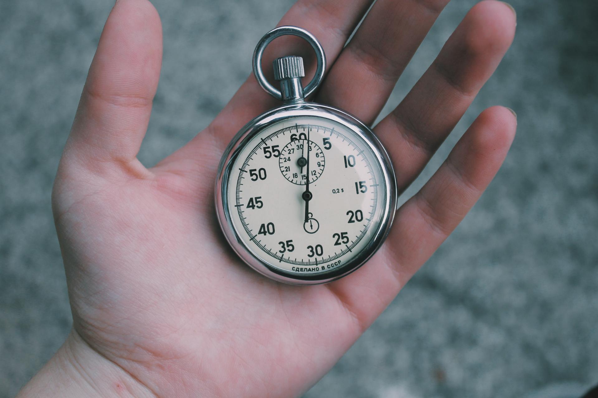 Stopwatch on top of a hand