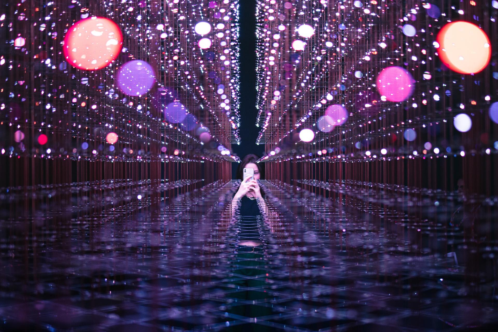 Interesting image of digital environment and girl with phone in the background