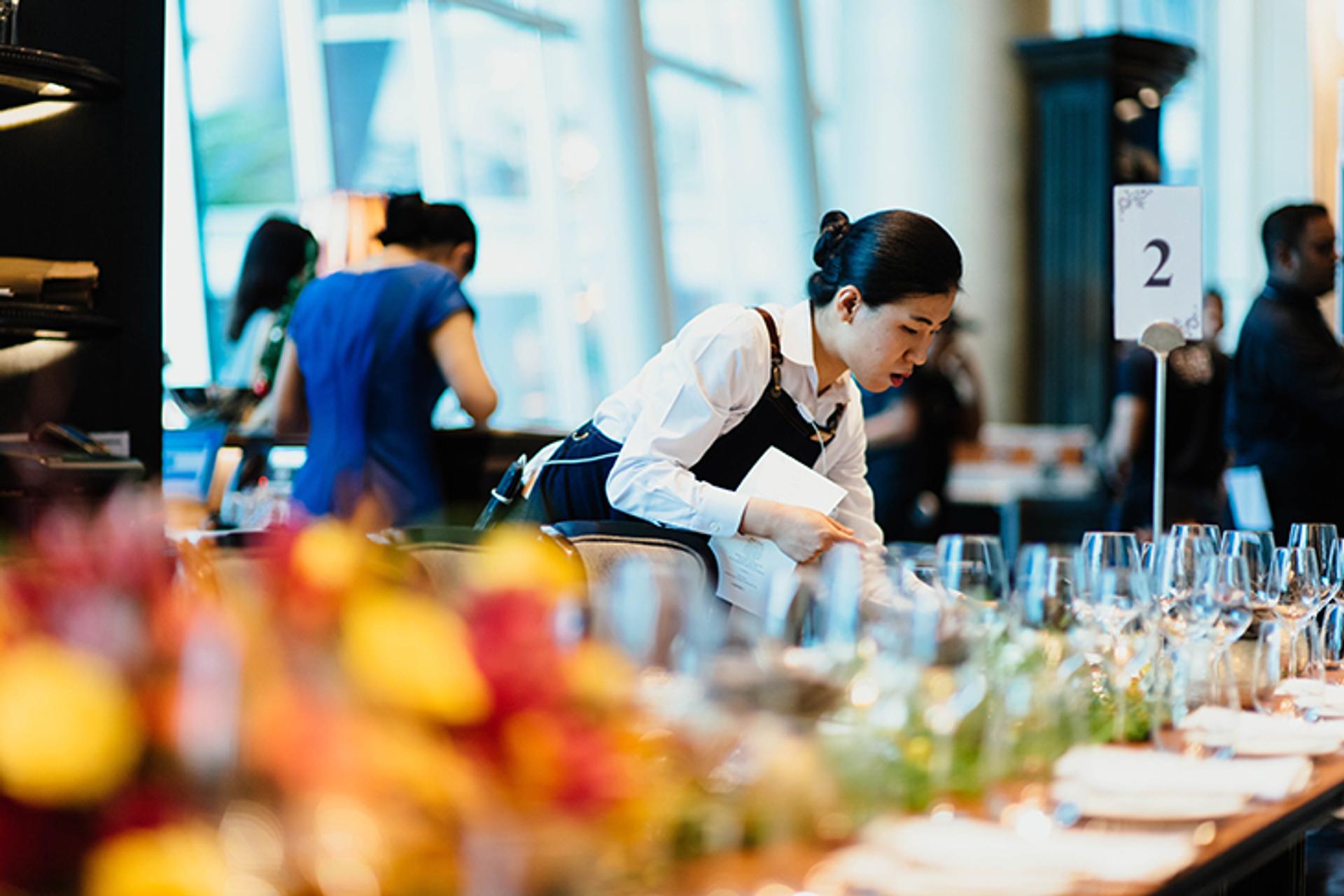 waitress preparing tables