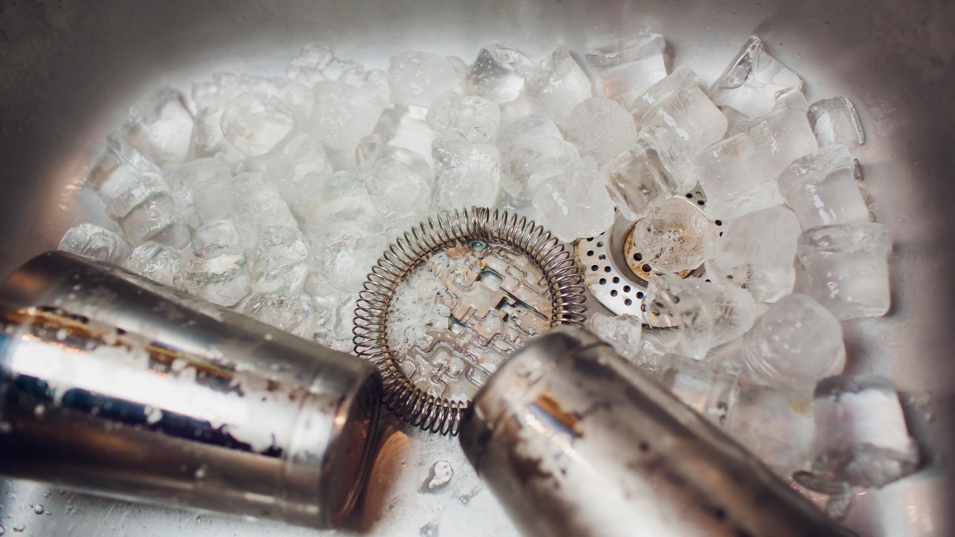 bartender equipment in a sink with ice