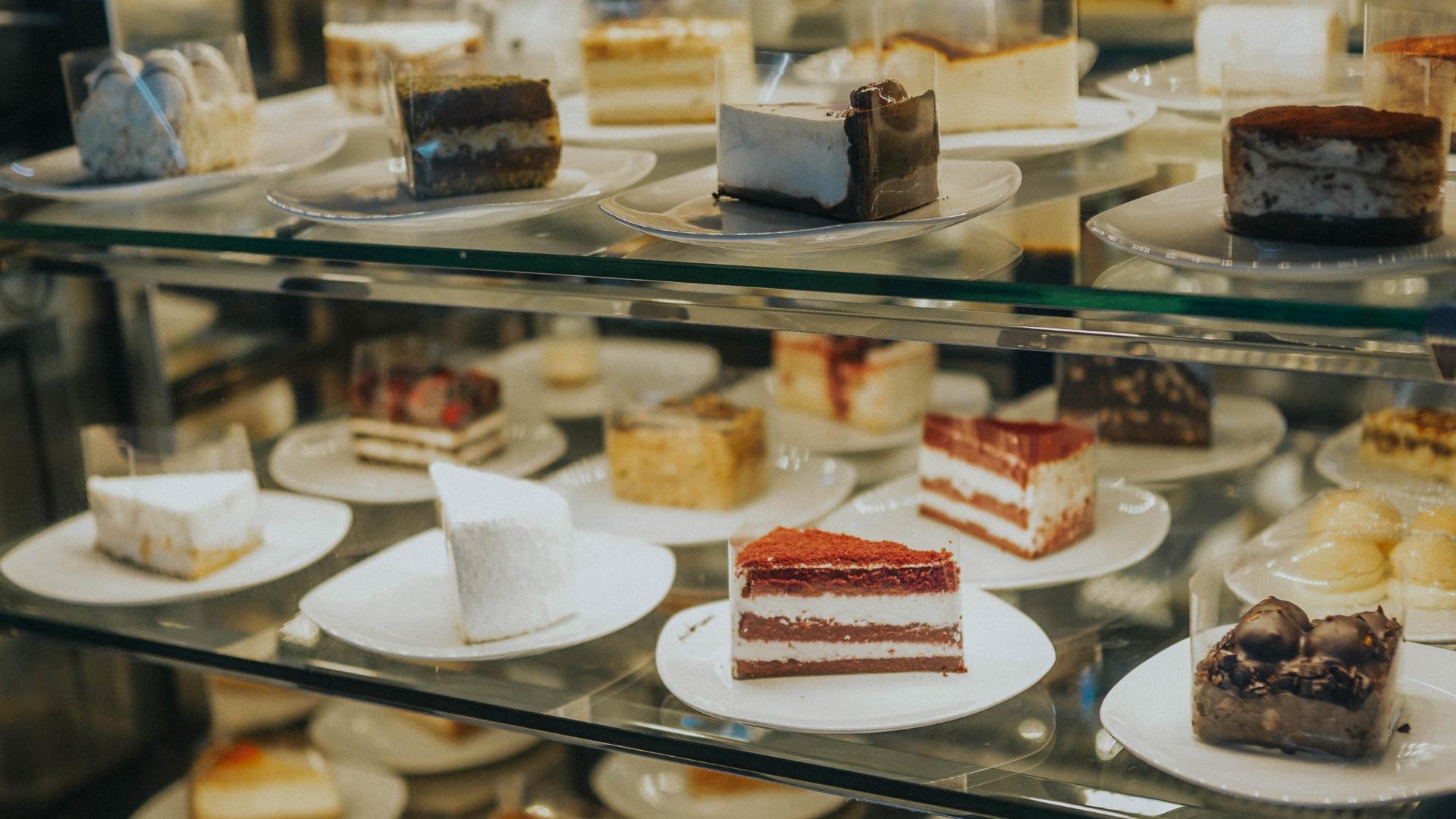 coffee shop display with several desserts