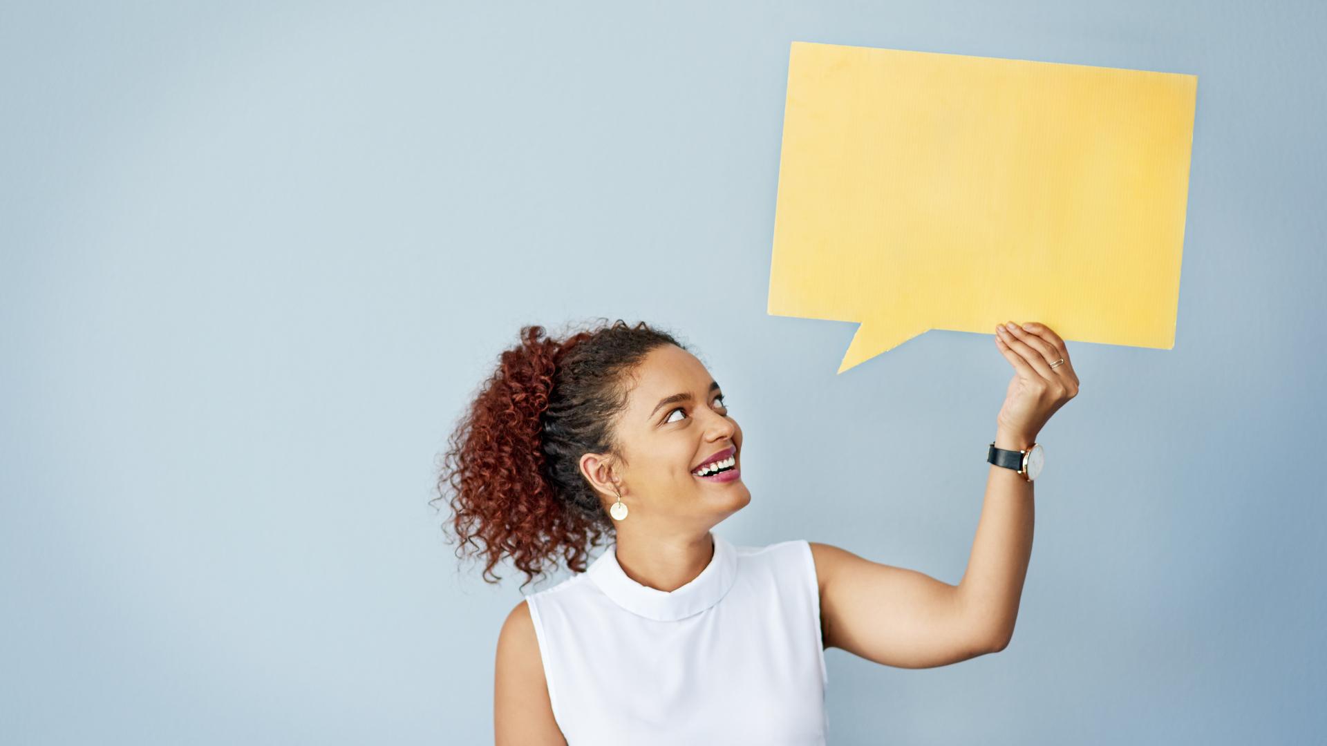 woman holding dialog box