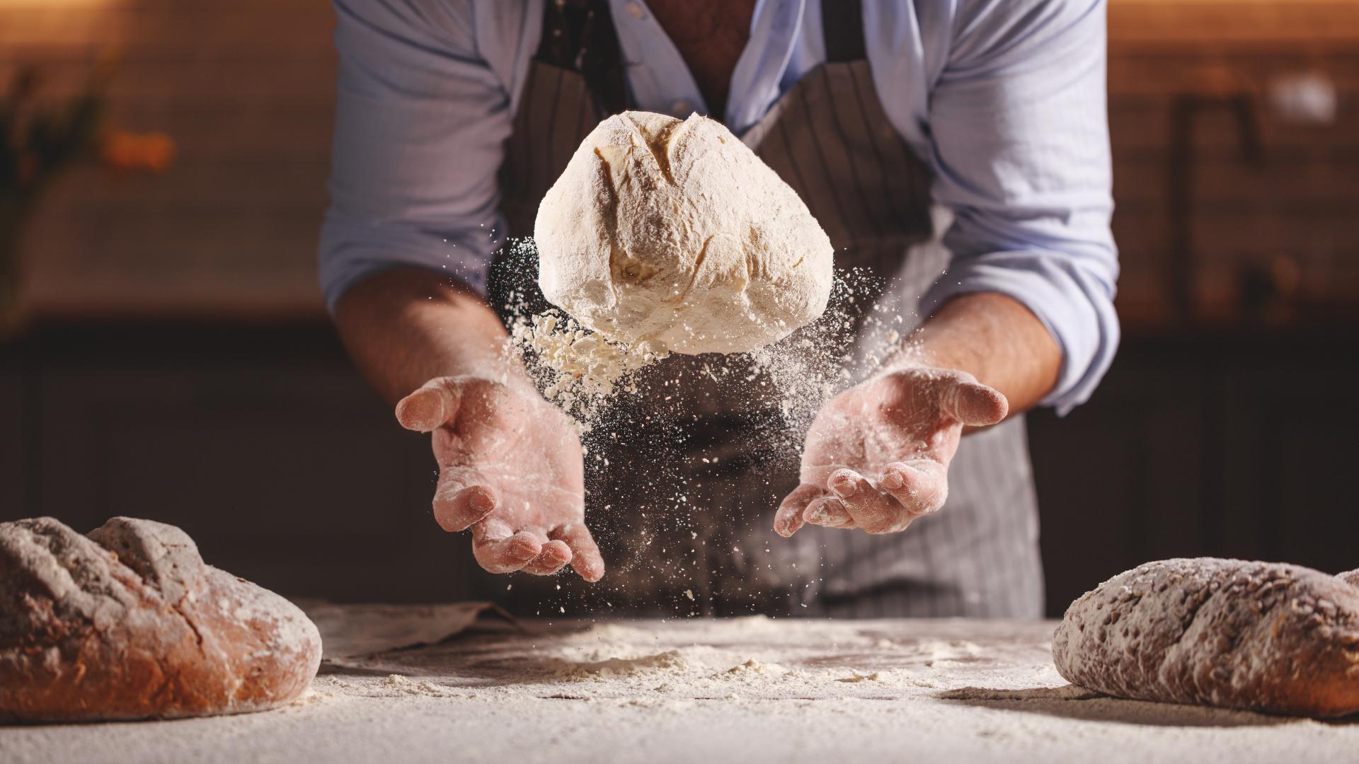 expert baker making bread