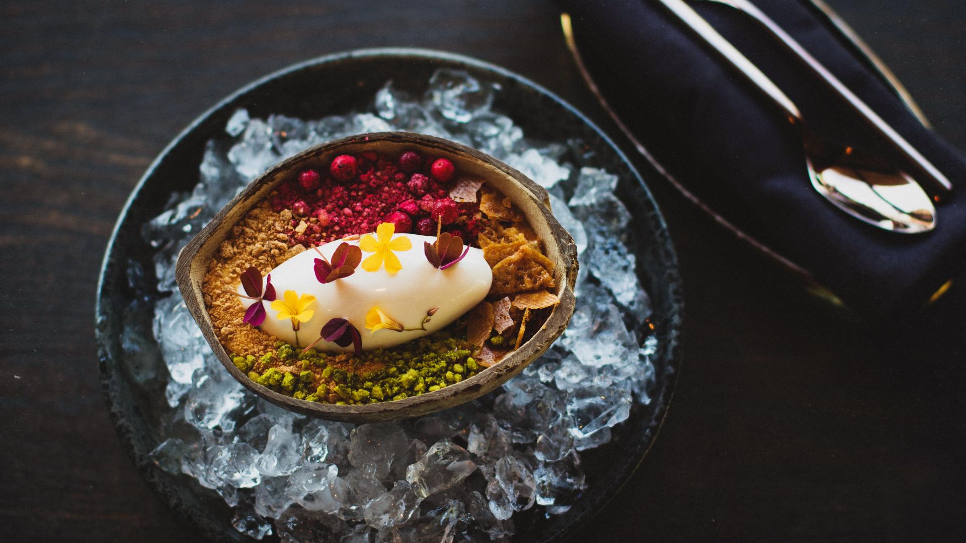 fusion food served inside a coconut