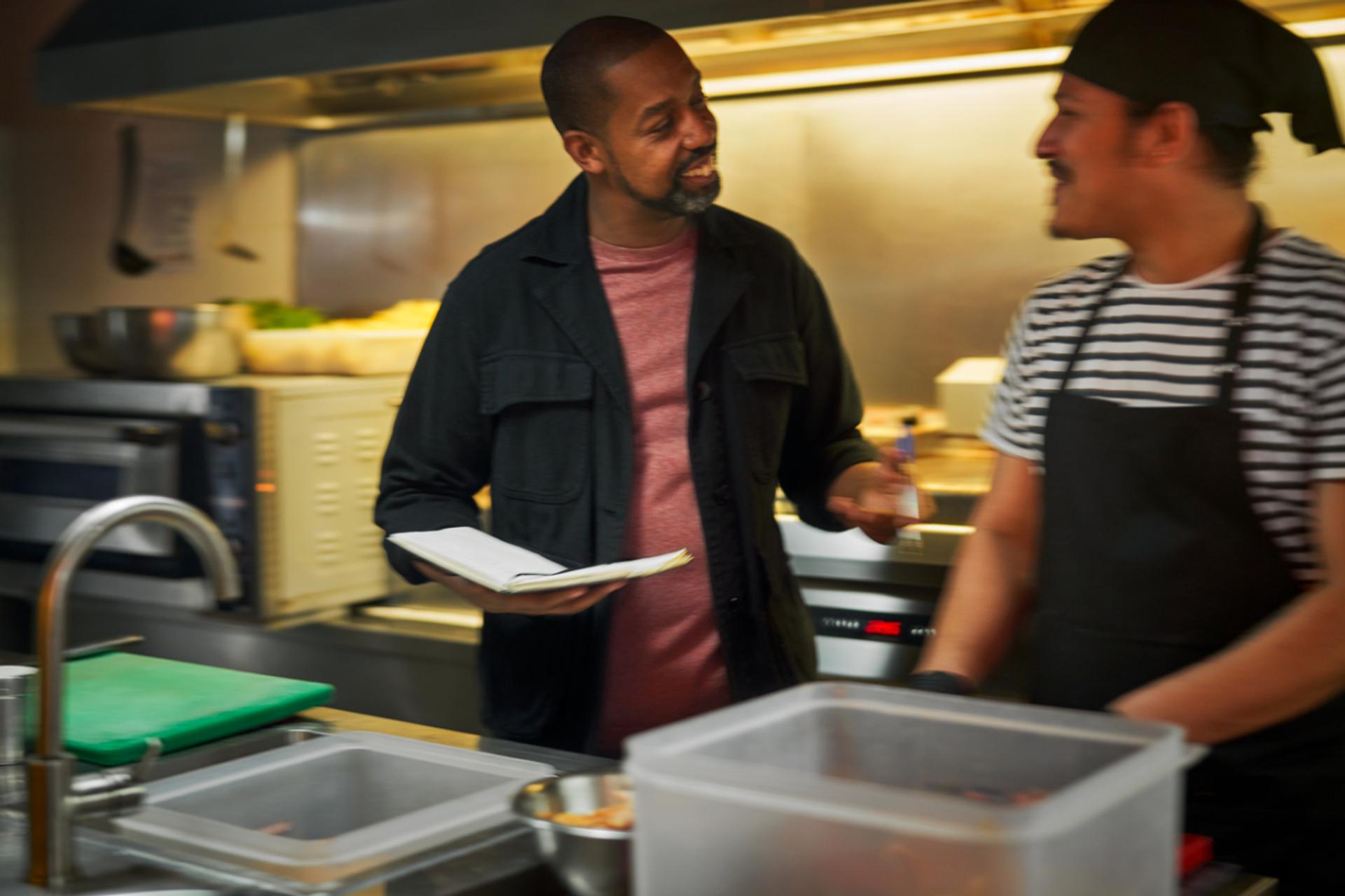 guys talking in the kitchen