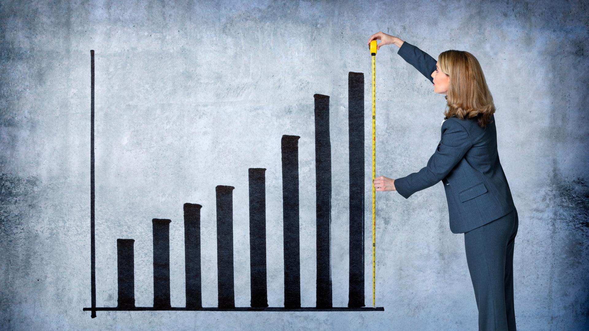 woman measuring a restaurant's growth