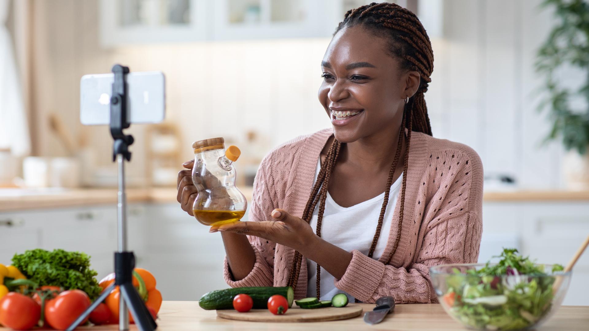 woman recording a recipe with her phone